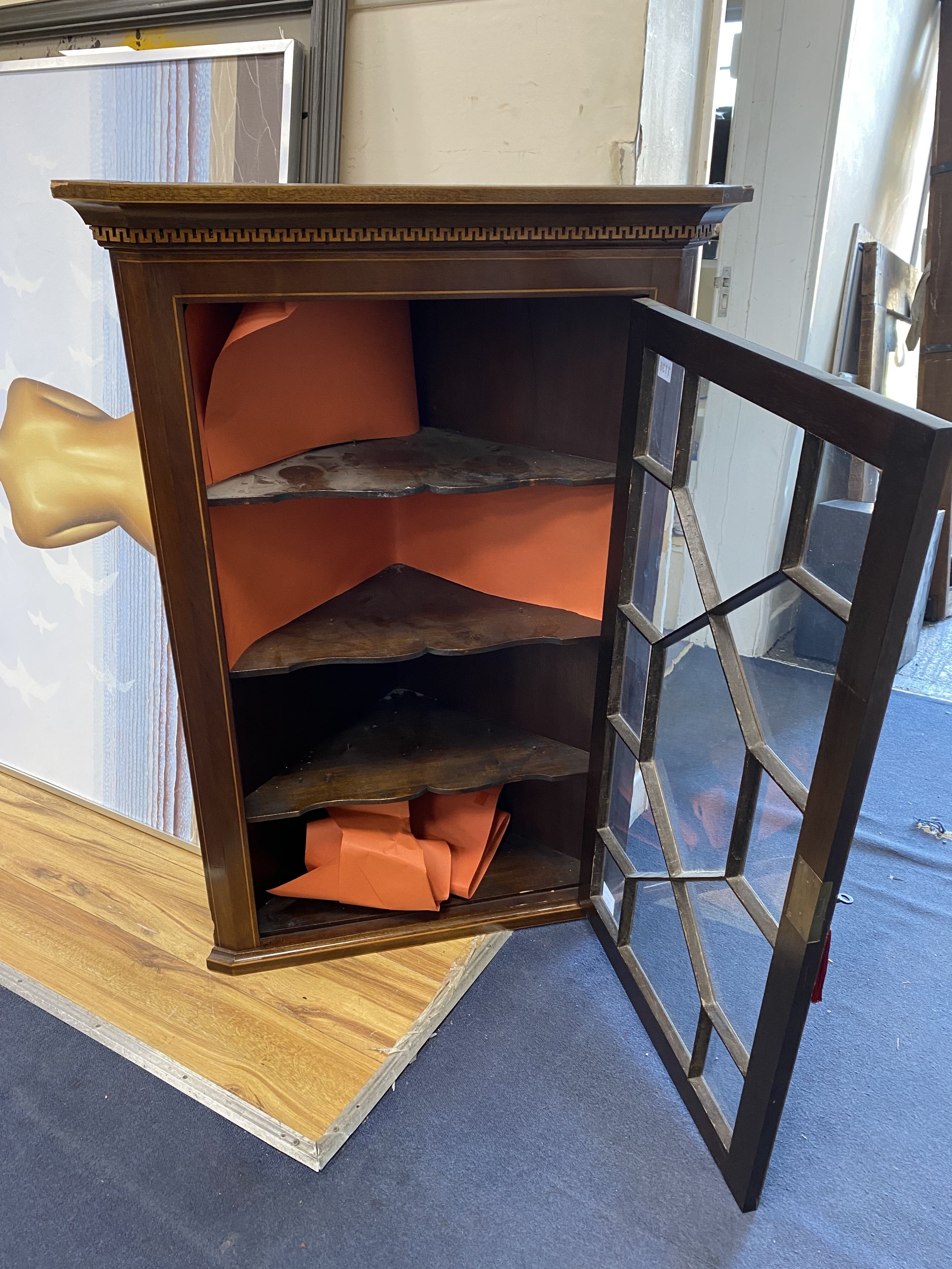 A George III inlaid mahogany hanging corner cabinet, width 71cm, depth 38cm, height 106cm